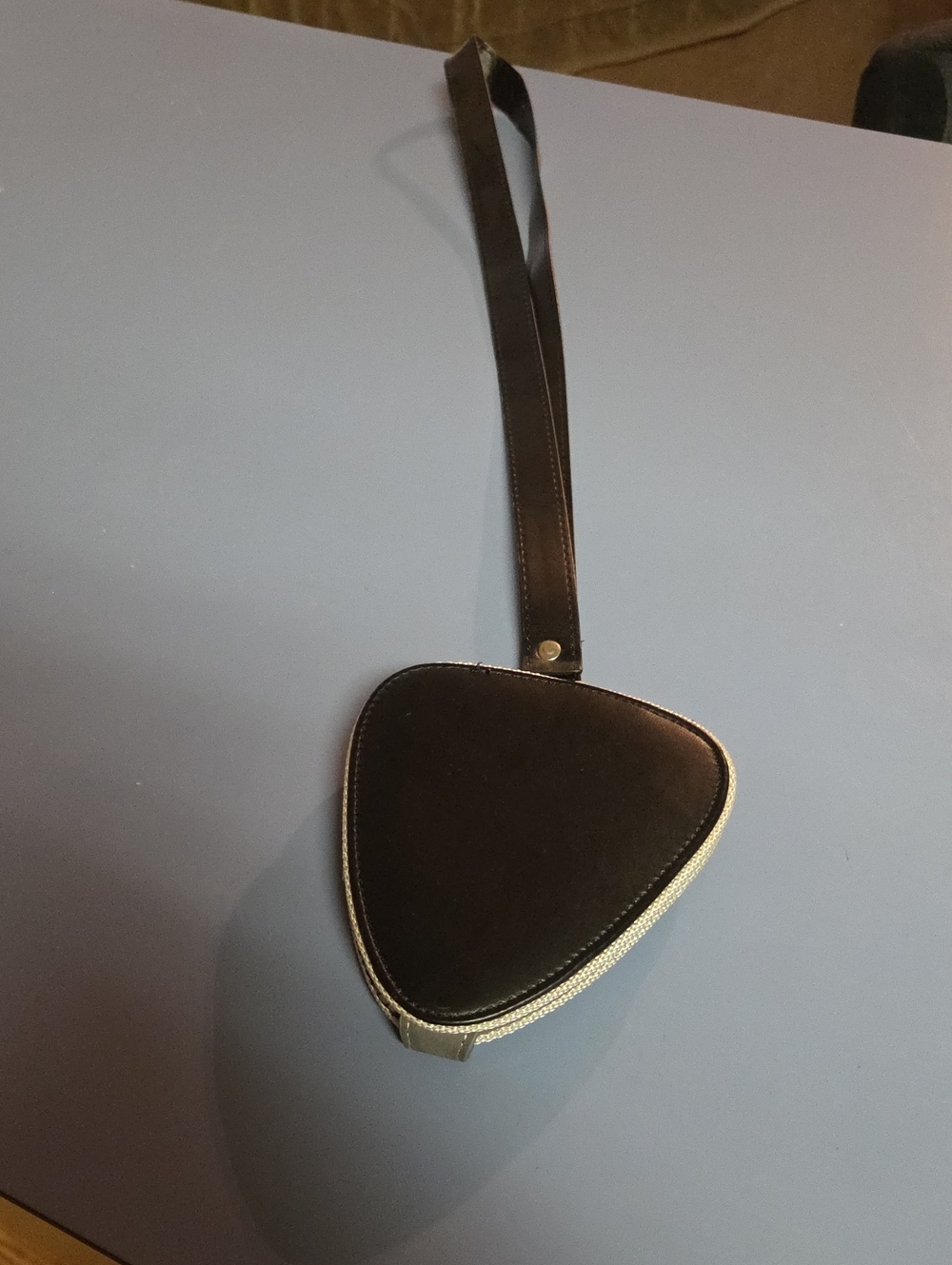 Black Triangle Wristlet Guitar Holder.